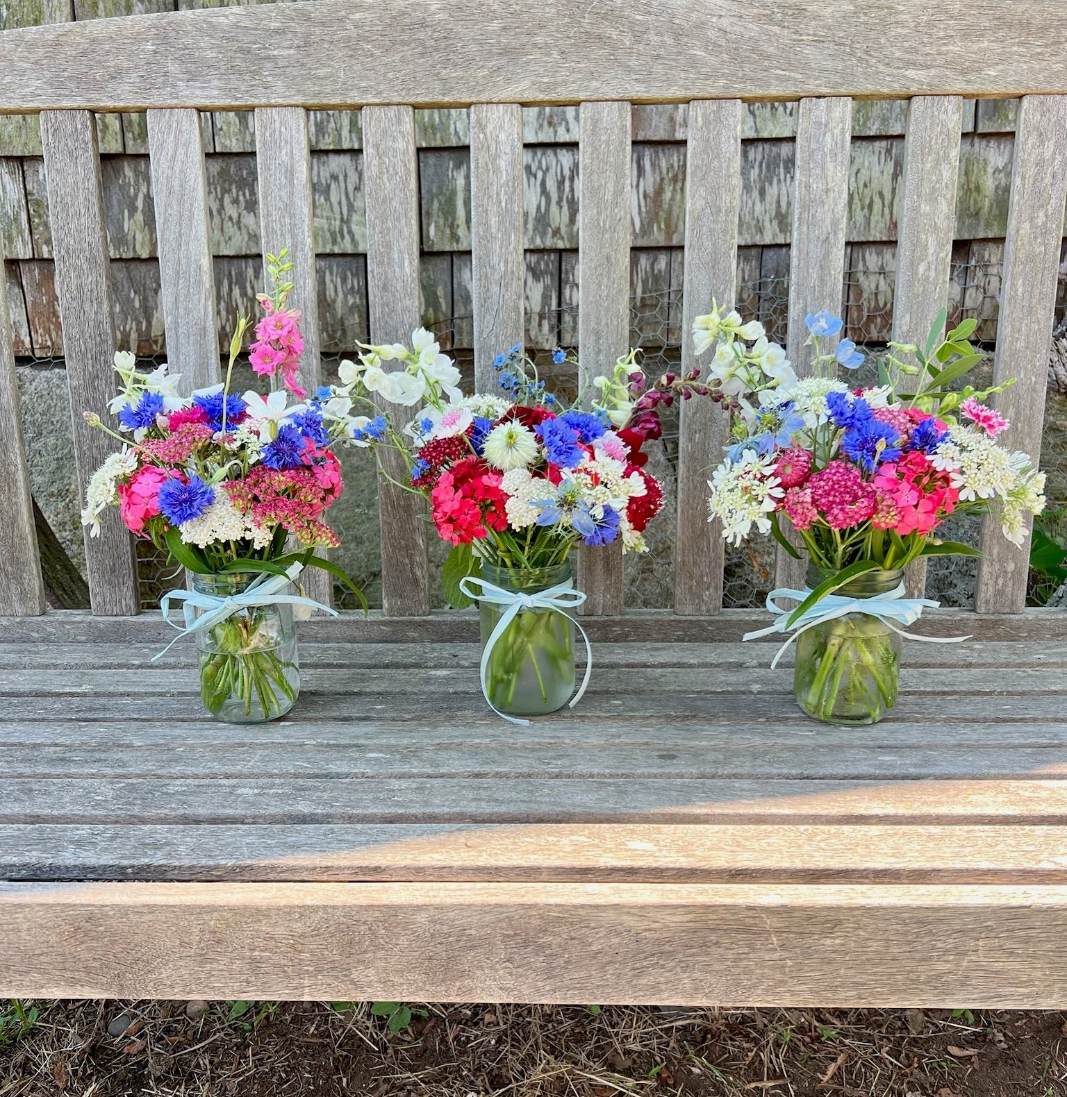 red white and blue mason jar flowers